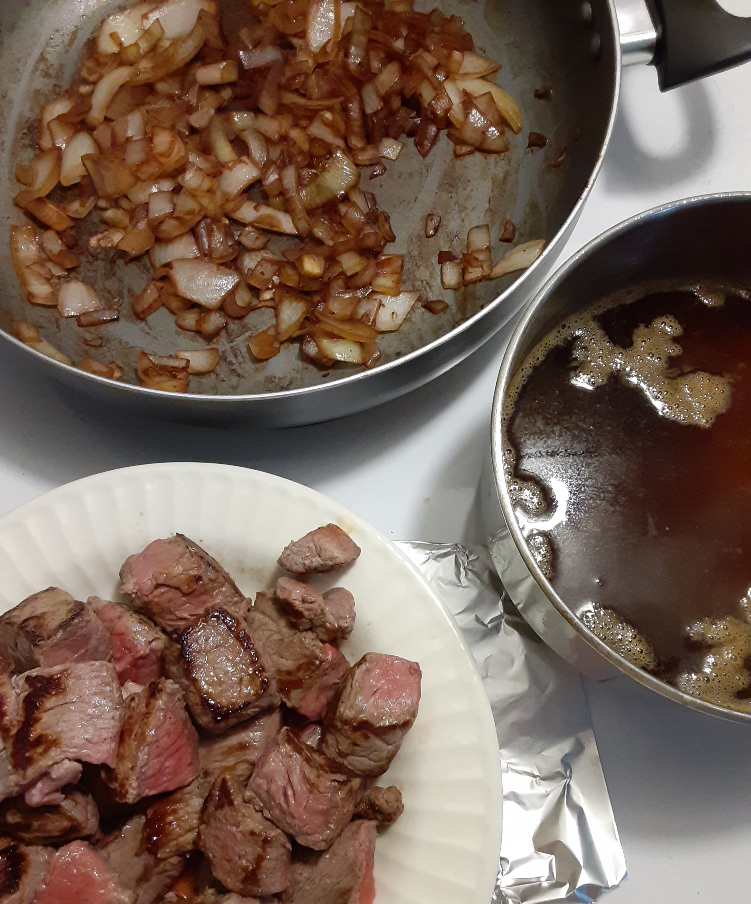 Cook onions, add wine, add beef